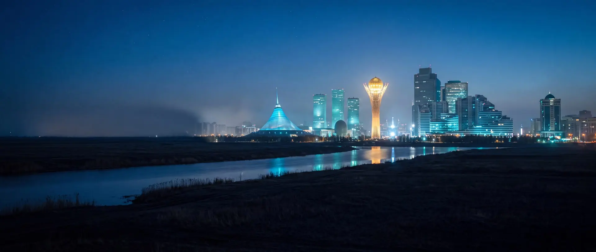 Astana skyline with the Bayterek tower at night
